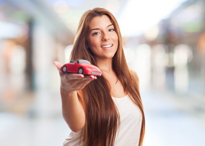 woman-shows-toy-car (2) woman-shows-toy-car (2)